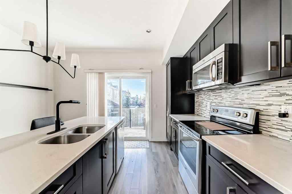 MLS® A2266106 - Unit #129 2802 Kings Heights Gate SE in Ravenswood Airdrie, Residential