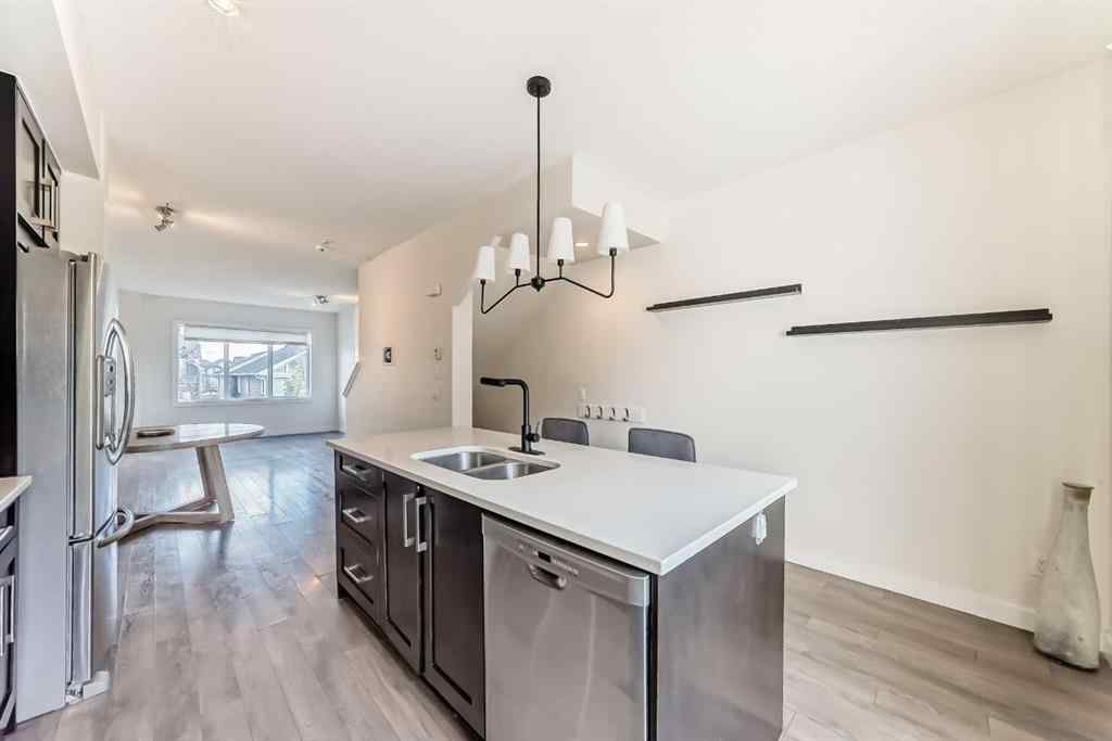 MLS® A2266106 - Unit #129 2802 Kings Heights Gate SE in Ravenswood Airdrie, Residential