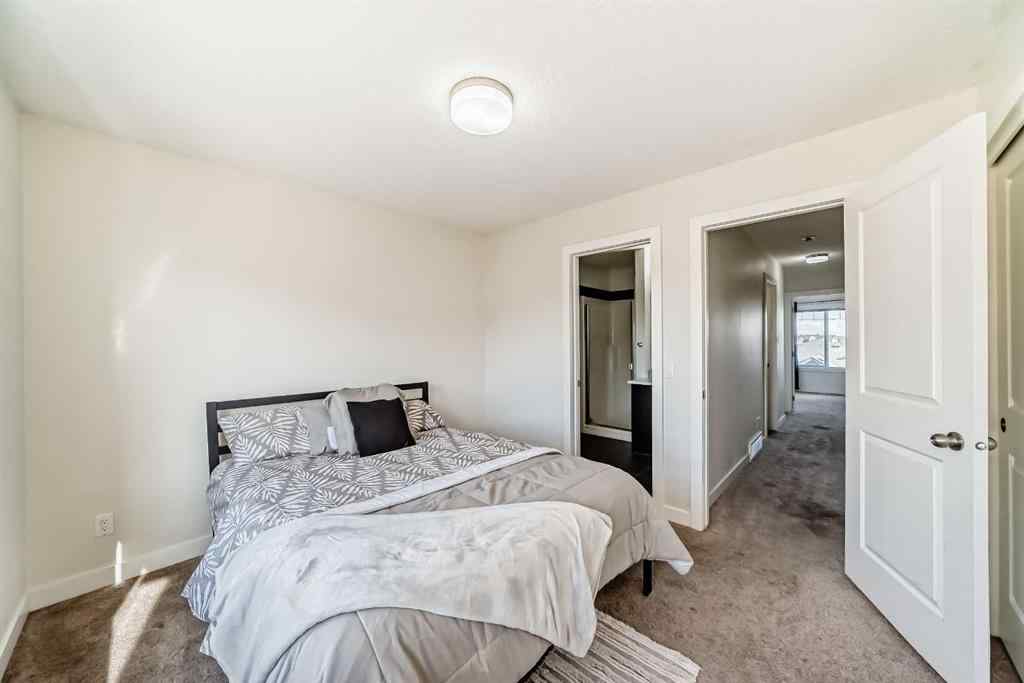 MLS® A2266106 - Unit #129 2802 Kings Heights Gate SE in Ravenswood Airdrie, Residential