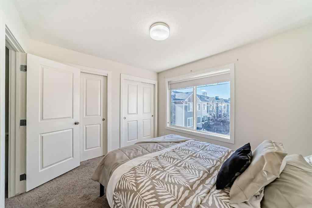 MLS® A2266106 - Unit #129 2802 Kings Heights Gate SE in Ravenswood Airdrie, Residential