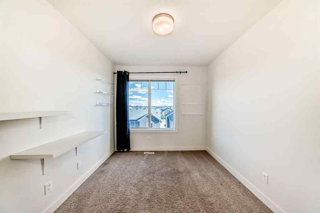 MLS® A2266106 - Unit #129 2802 Kings Heights Gate SE in Ravenswood Airdrie, Residential