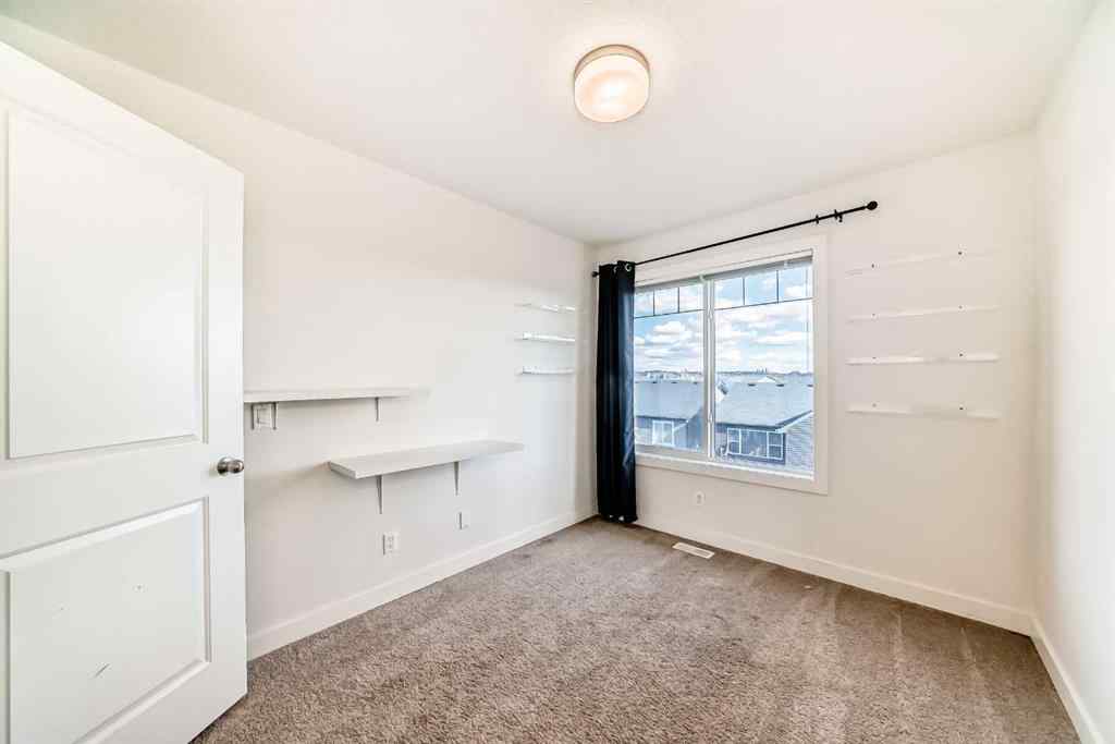 MLS® A2266106 - Unit #129 2802 Kings Heights Gate SE in Ravenswood Airdrie, Residential