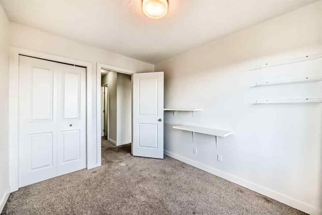 MLS® A2266106 - Unit #129 2802 Kings Heights Gate SE in Ravenswood Airdrie, Residential