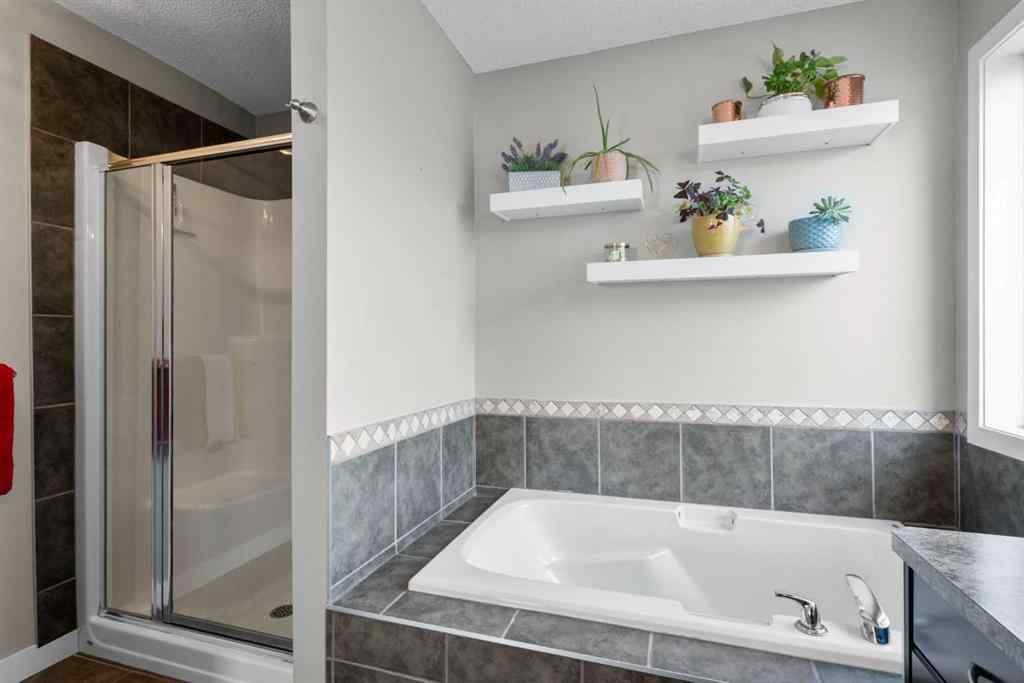 MLS® A2266136 - 2581 Coopers Circle SW in Coopers Crossing Airdrie, Residential