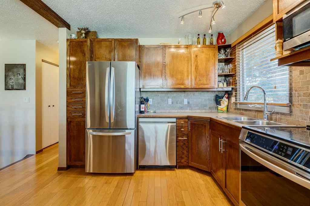 MLS® A2266156 - 150 Midcrest Crescent SE in Midnapore Calgary, Residential