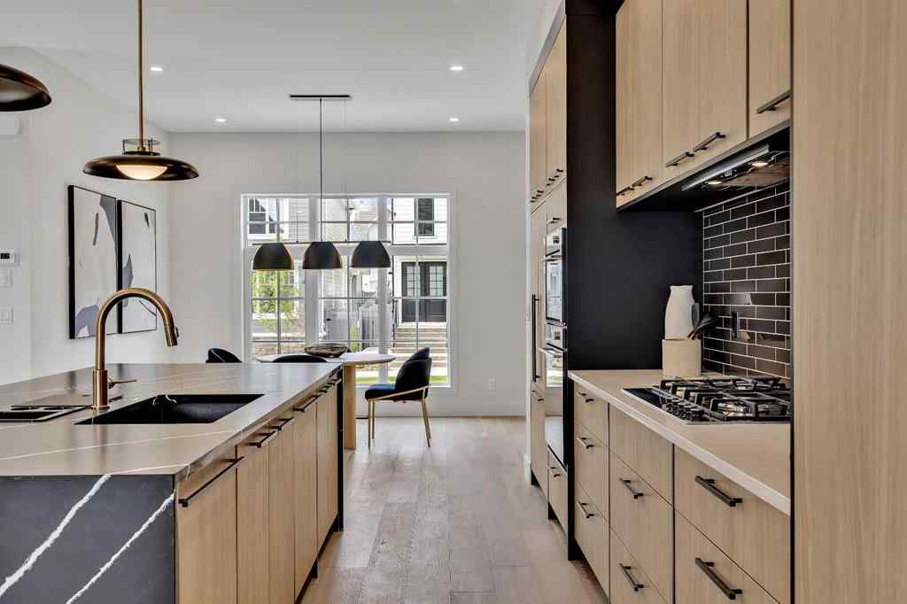 MLS® A2266229 - 330 Normandy Drive SW in Currie Barracks Calgary, Residential