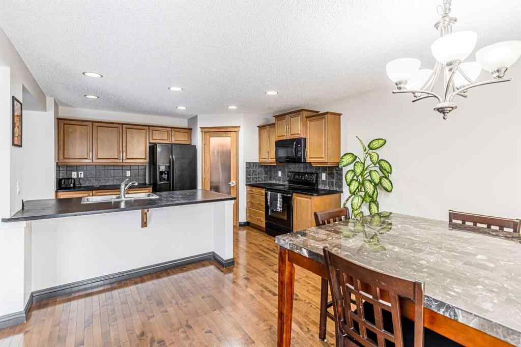 MLS® A2266274 - 1430 Kings Heights Boulevard SE in Kings Heights Airdrie, Residential