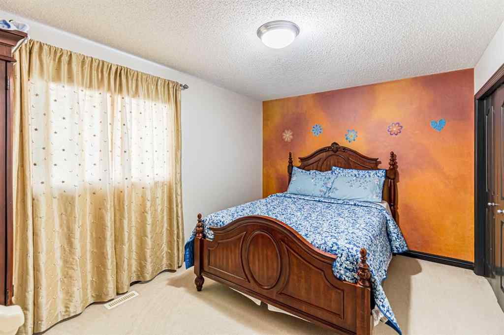 MLS® A2266274 - 1430 Kings Heights Boulevard SE in Kings Heights Airdrie, Residential