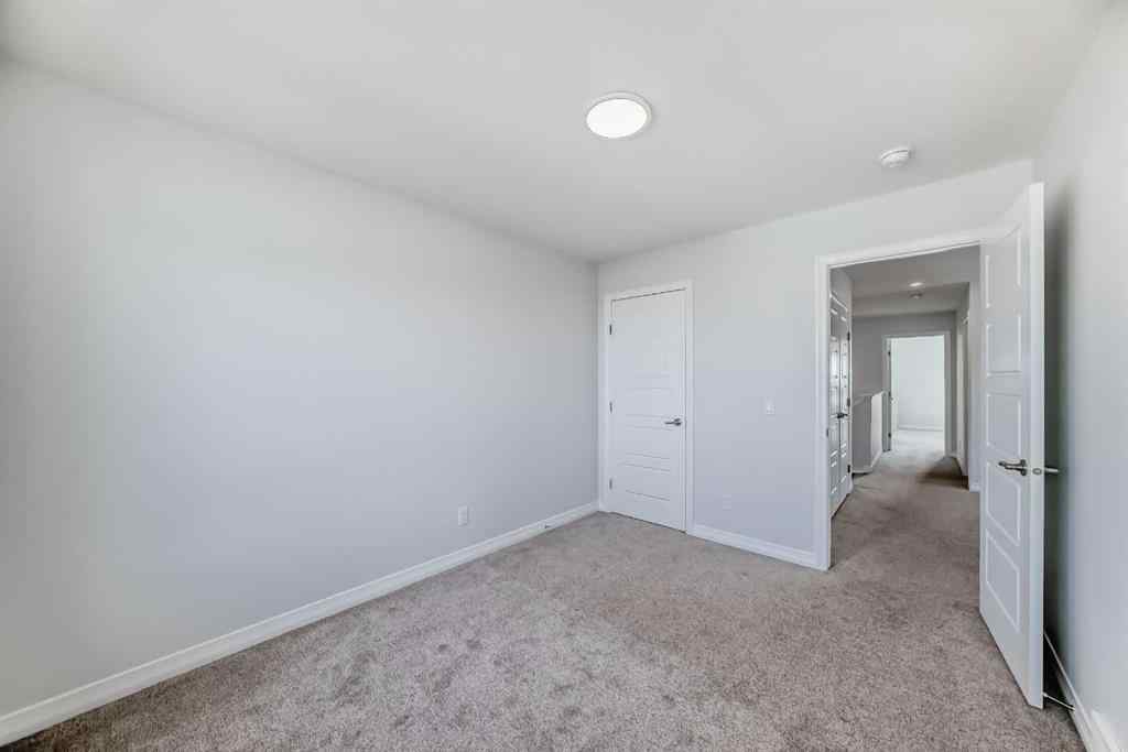 MLS® A2266305 - 120 Belmont Boulevard SW in Belmont Calgary, Residential