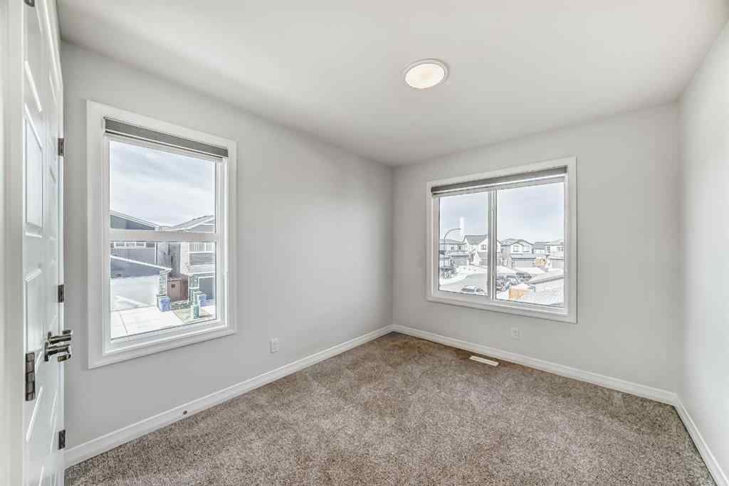 MLS® A2266305 - 120 Belmont Boulevard SW in Belmont Calgary, Residential