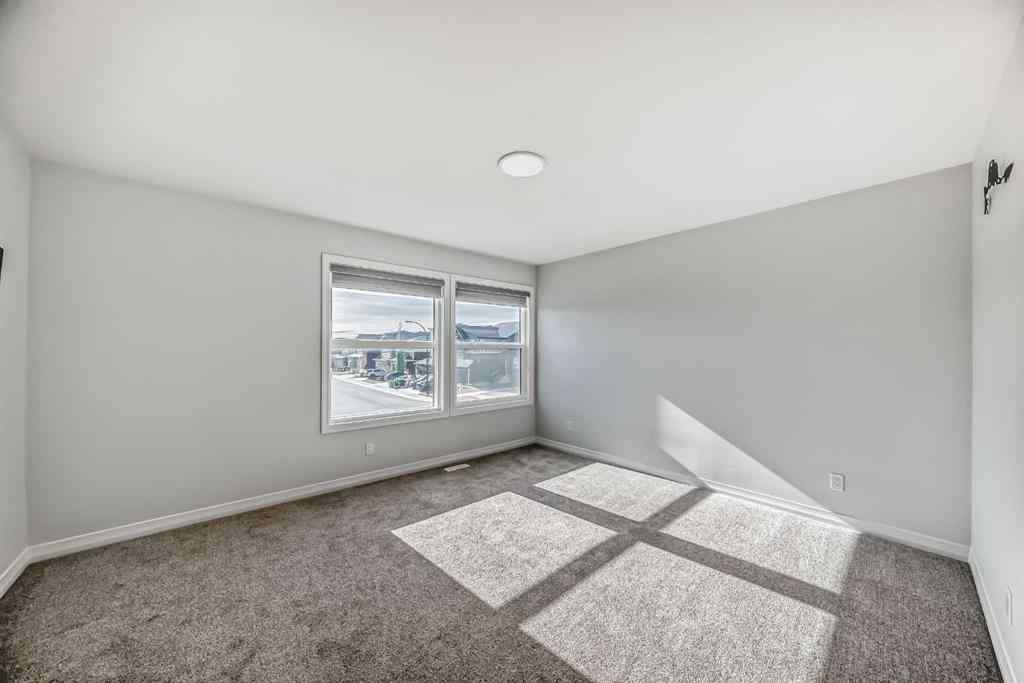 MLS® A2266305 - 120 Belmont Boulevard SW in Belmont Calgary, Residential