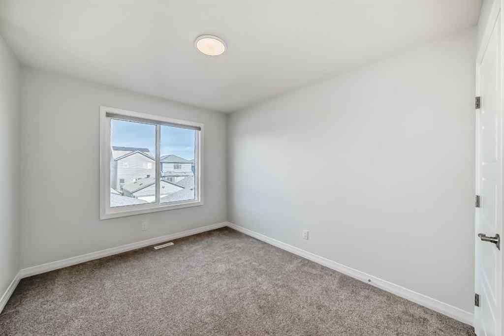 MLS® A2266305 - 120 Belmont Boulevard SW in Belmont Calgary, Residential