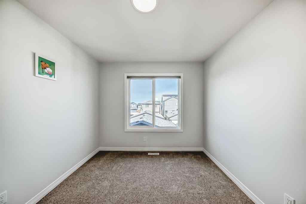 MLS® A2266305 - 120 Belmont Boulevard SW in Belmont Calgary, Residential