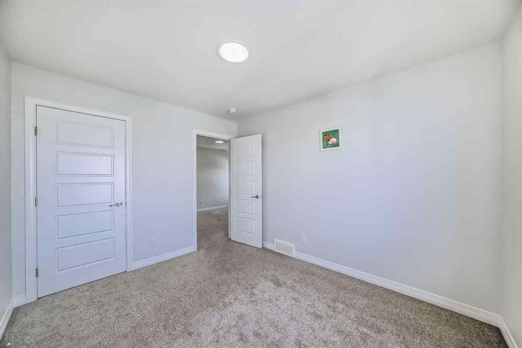 MLS® A2266305 - 120 Belmont Boulevard SW in Belmont Calgary, Residential