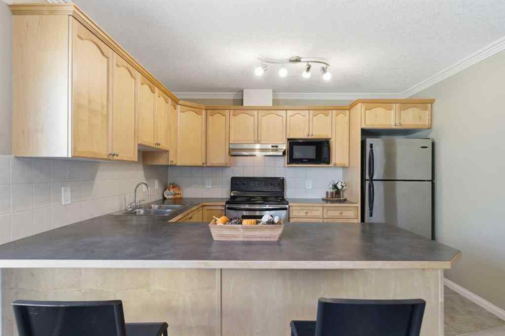 MLS® A2266383 - Unit #103 128 Centre Avenue  in East End Cochrane, Residential