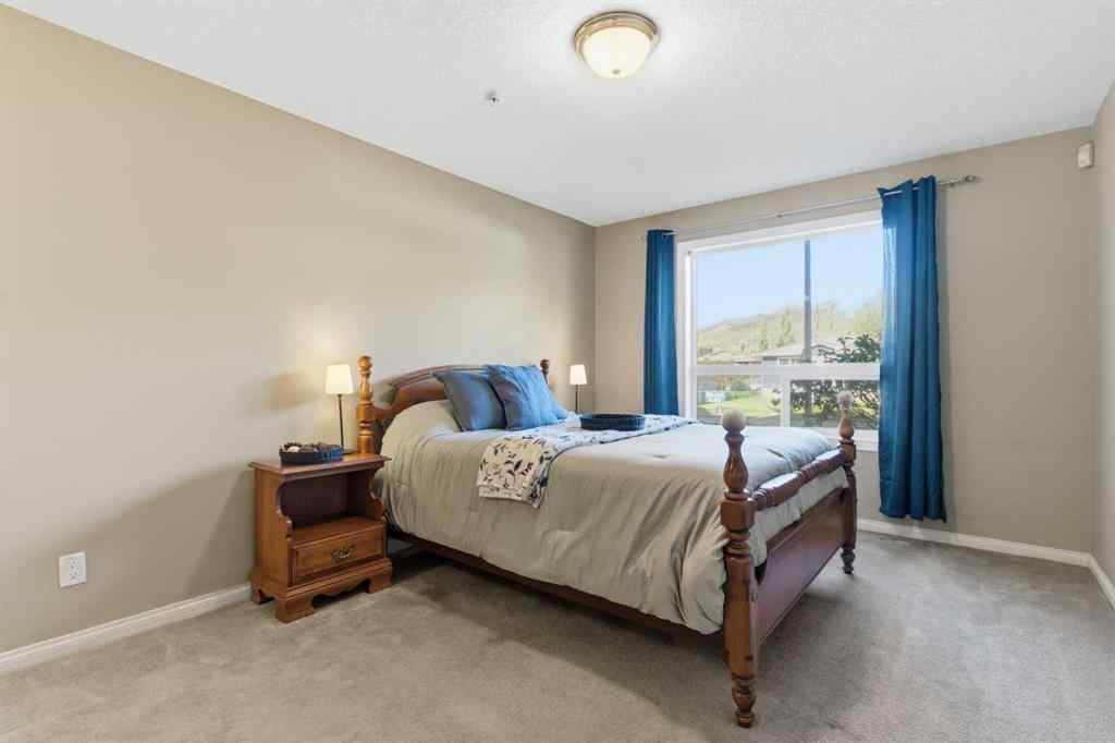 MLS® A2266383 - Unit #103 128 Centre Avenue  in East End Cochrane, Residential