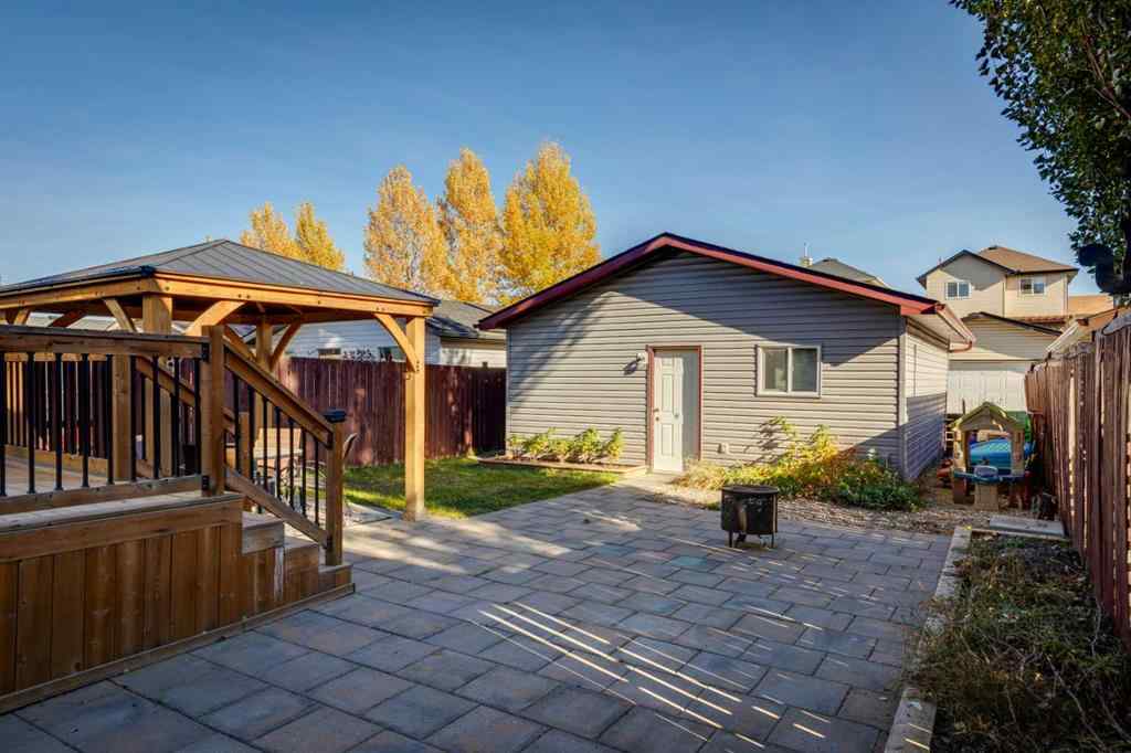 MLS® A2266485 - 85 Crystal Shores Crescent  in Crystal Shores Okotoks, Residential