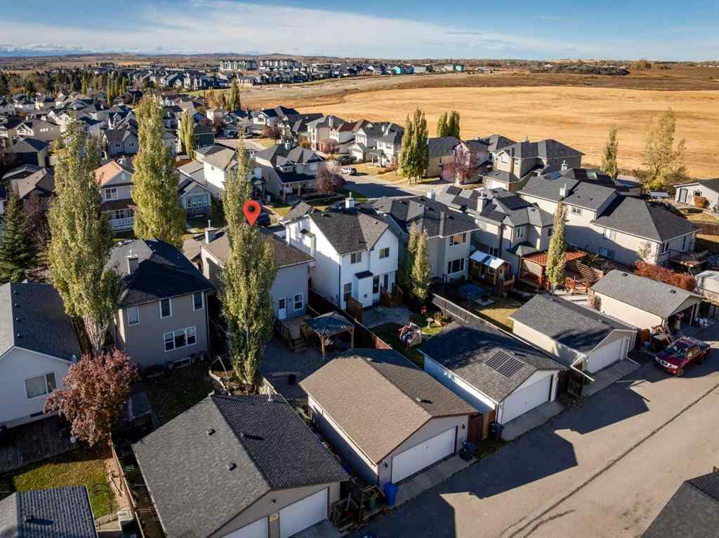 MLS® A2266485 - 85 Crystal Shores Crescent  in Crystal Shores Okotoks, Residential