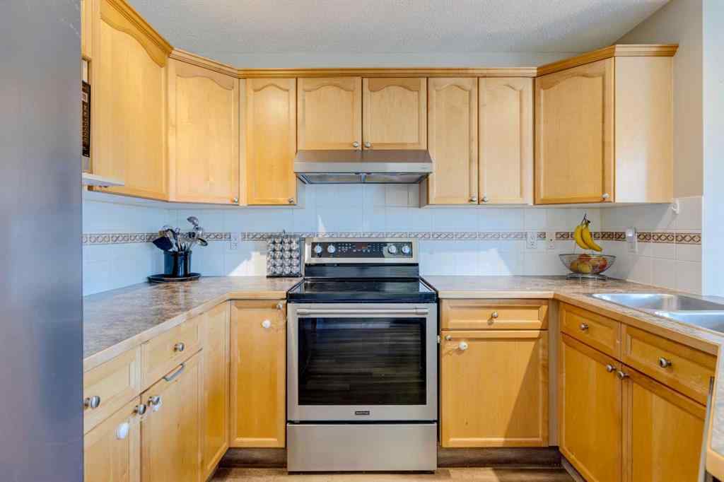 MLS® A2266485 - 85 Crystal Shores Crescent  in Crystal Shores Okotoks, Residential