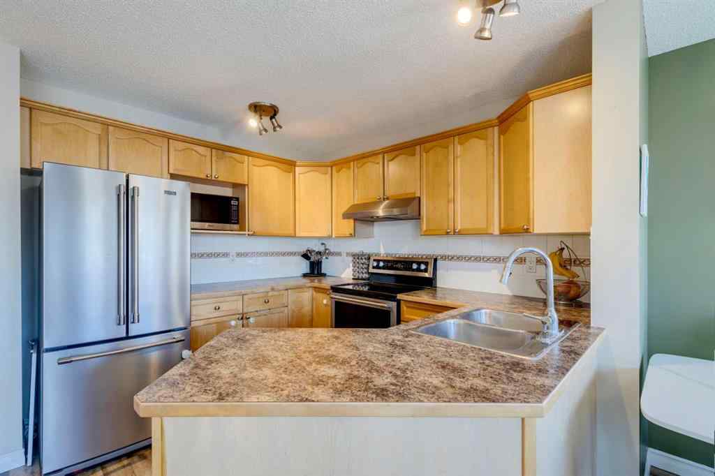 MLS® A2266485 - 85 Crystal Shores Crescent  in Crystal Shores Okotoks, Residential