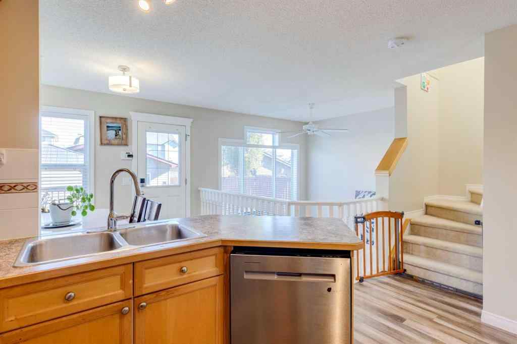 MLS® A2266485 - 85 Crystal Shores Crescent  in Crystal Shores Okotoks, Residential