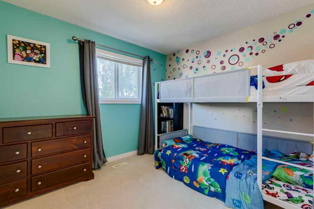 MLS® A2266485 - 85 Crystal Shores Crescent  in Crystal Shores Okotoks, Residential