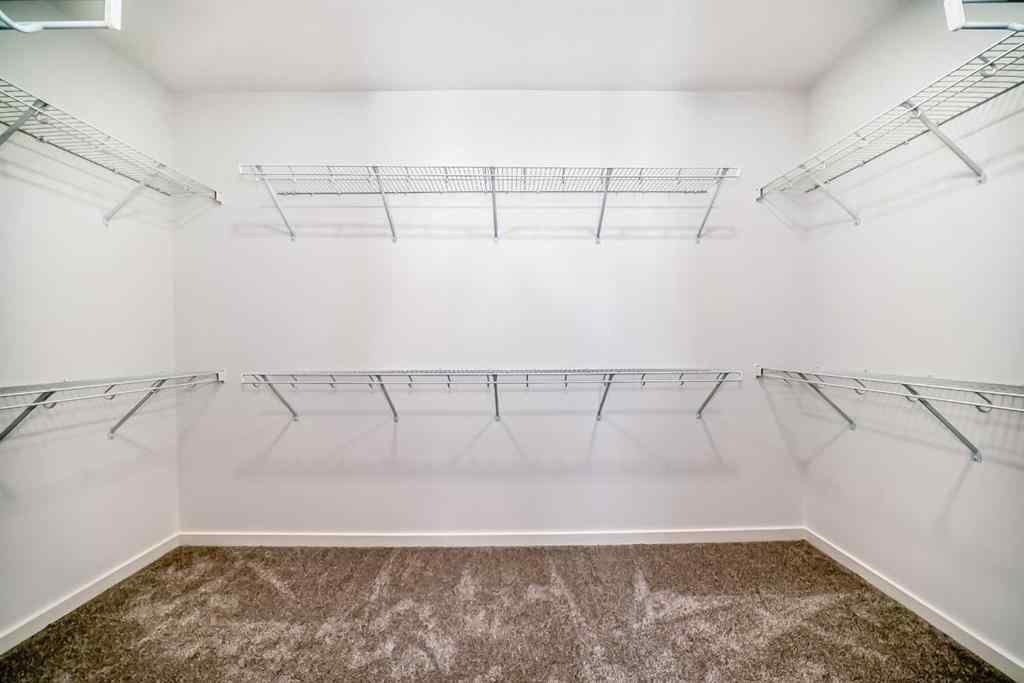 MLS® A2266517 - 52 Creekside Path SW in Pine Creek Calgary, Residential