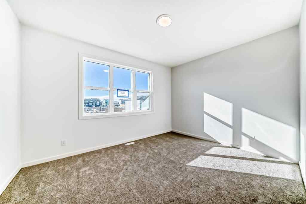 MLS® A2266517 - 52 Creekside Path SW in Pine Creek Calgary, Residential