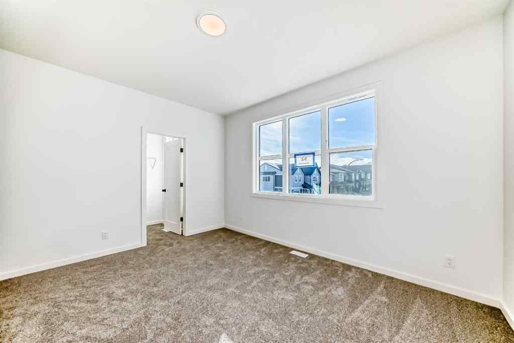 MLS® A2266517 - 52 Creekside Path SW in Pine Creek Calgary, Residential