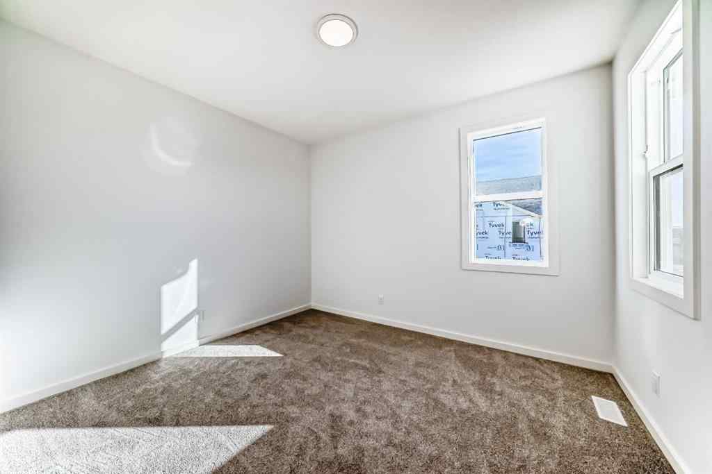 MLS® A2266517 - 52 Creekside Path SW in Pine Creek Calgary, Residential