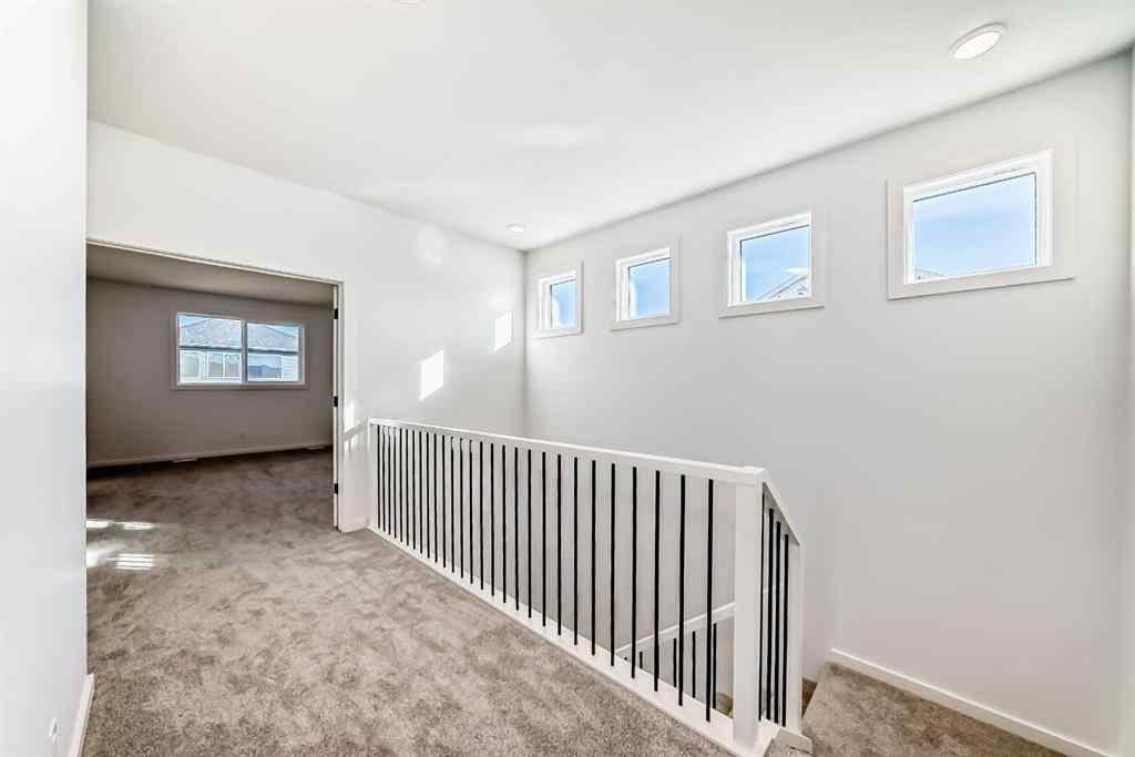 MLS® A2266517 - 52 Creekside Path SW in Pine Creek Calgary, Residential