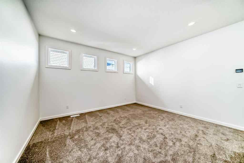 MLS® A2266517 - 52 Creekside Path SW in Pine Creek Calgary, Residential