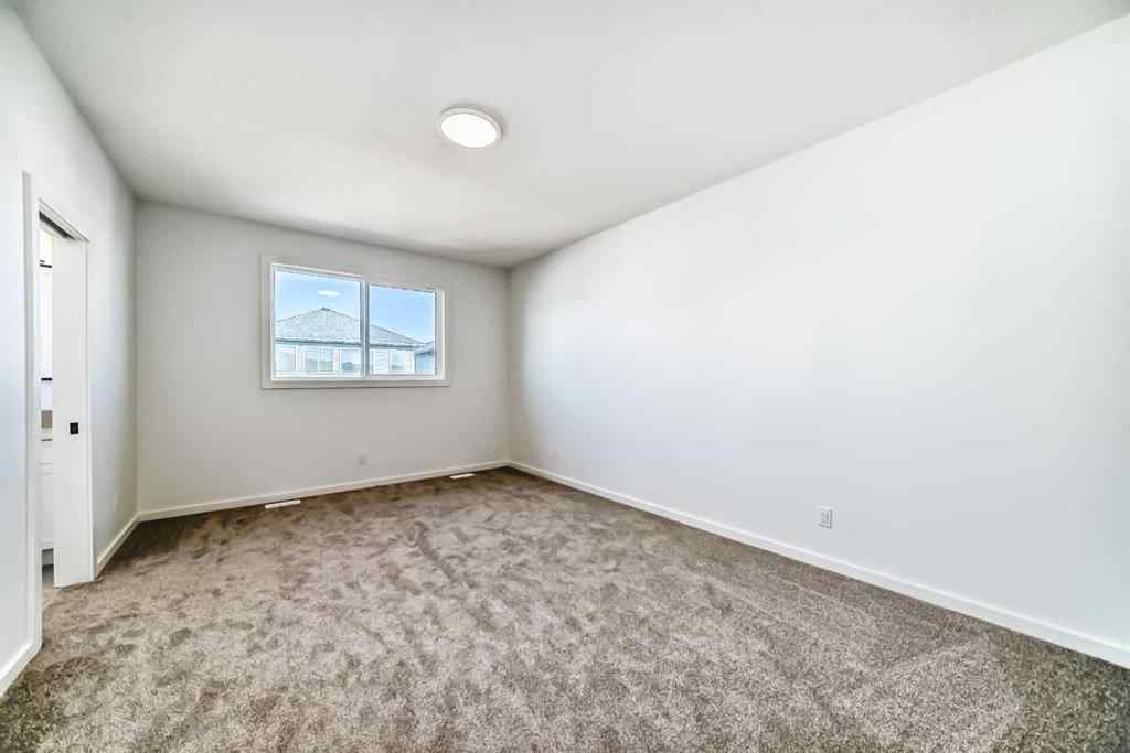 MLS® A2266517 - 52 Creekside Path SW in Pine Creek Calgary, Residential