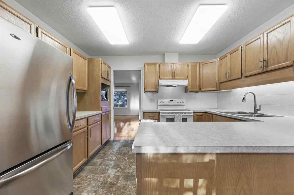MLS® A2266586 - 11 Coach Side Terrace SW in Coach Hill Calgary, Residential