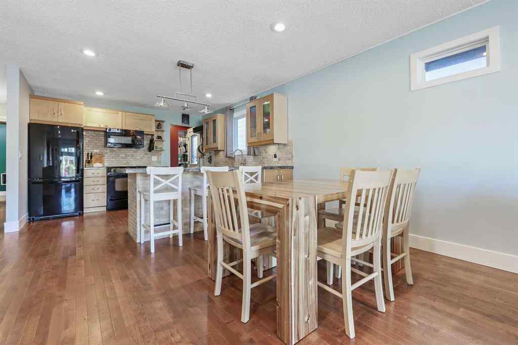 MLS® A2266811 - 52 Sunhurst Road SE in Sundance Calgary, Residential