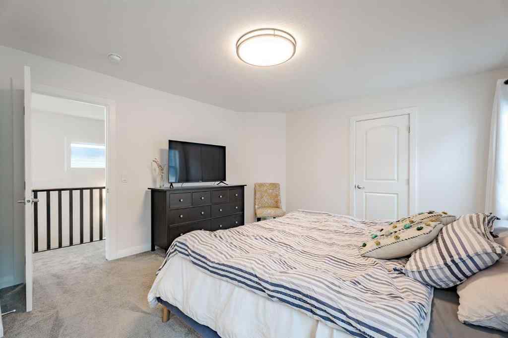 MLS® A2266873 - 2148 Ravensdun Crescent SE in Ravenswood Airdrie, Residential