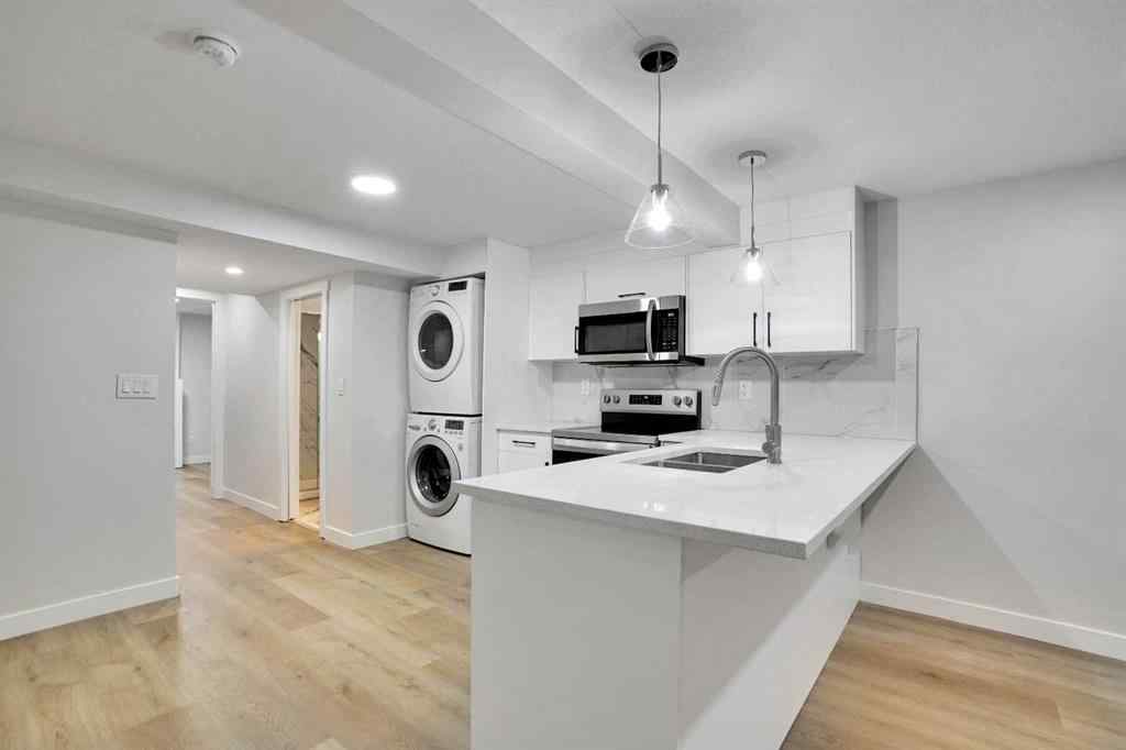 MLS® A2266880 - 903B Queensland Drive SE in Queensland Calgary, Residential