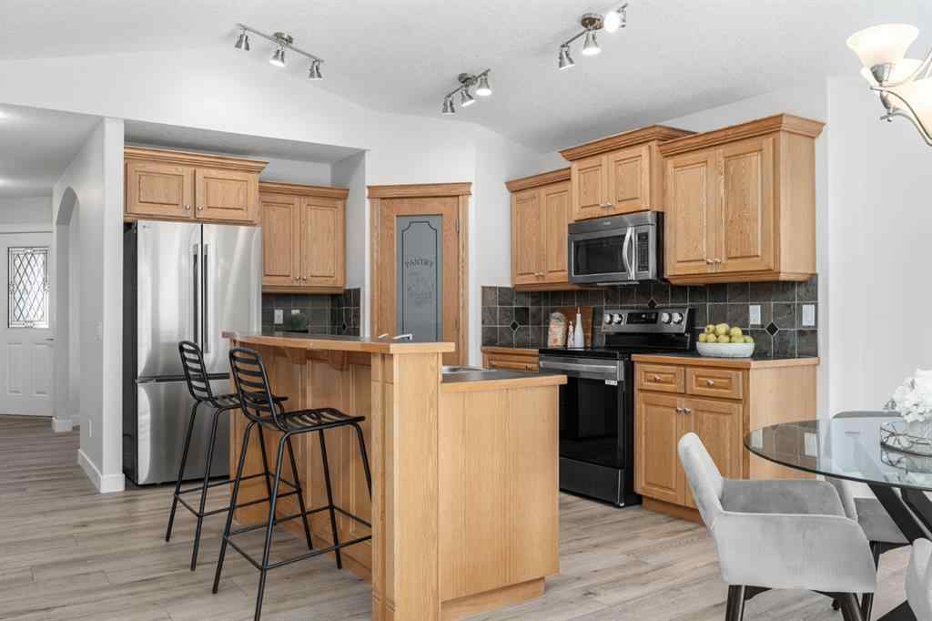 MLS® A2266914 - 111 Cimarron Park Circle  in Cimarron Park Okotoks, Residential