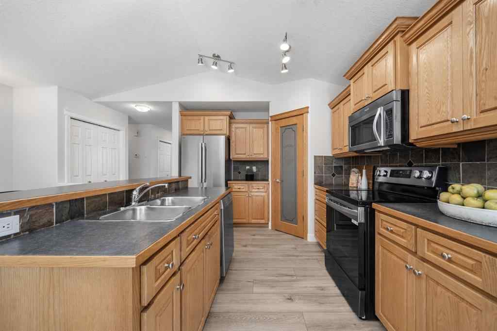 MLS® A2266914 - 111 Cimarron Park Circle  in Cimarron Park Okotoks, Residential