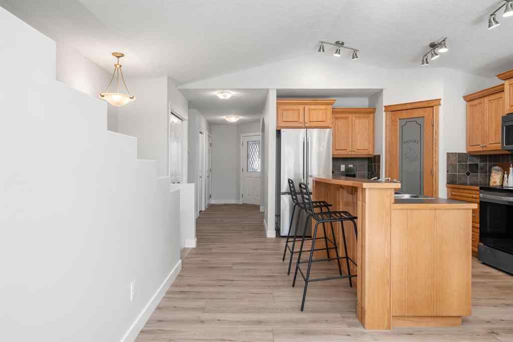 MLS® A2266914 - 111 Cimarron Park Circle  in Cimarron Park Okotoks, Residential