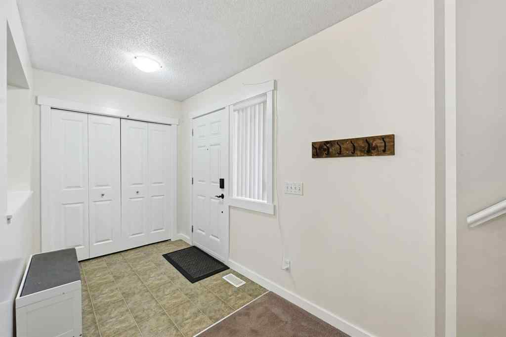 MLS® A2267001 - 217 coopers Grove SW in Coopers Crossing Airdrie, Residential
