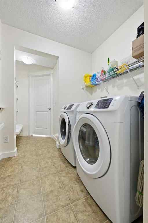 MLS® A2267001 - 217 coopers Grove SW in Coopers Crossing Airdrie, Residential