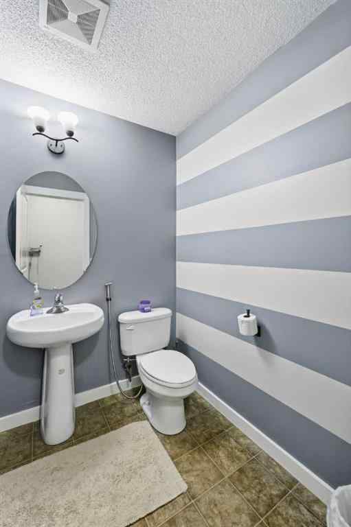 MLS® A2267001 - 217 coopers Grove SW in Coopers Crossing Airdrie, Residential