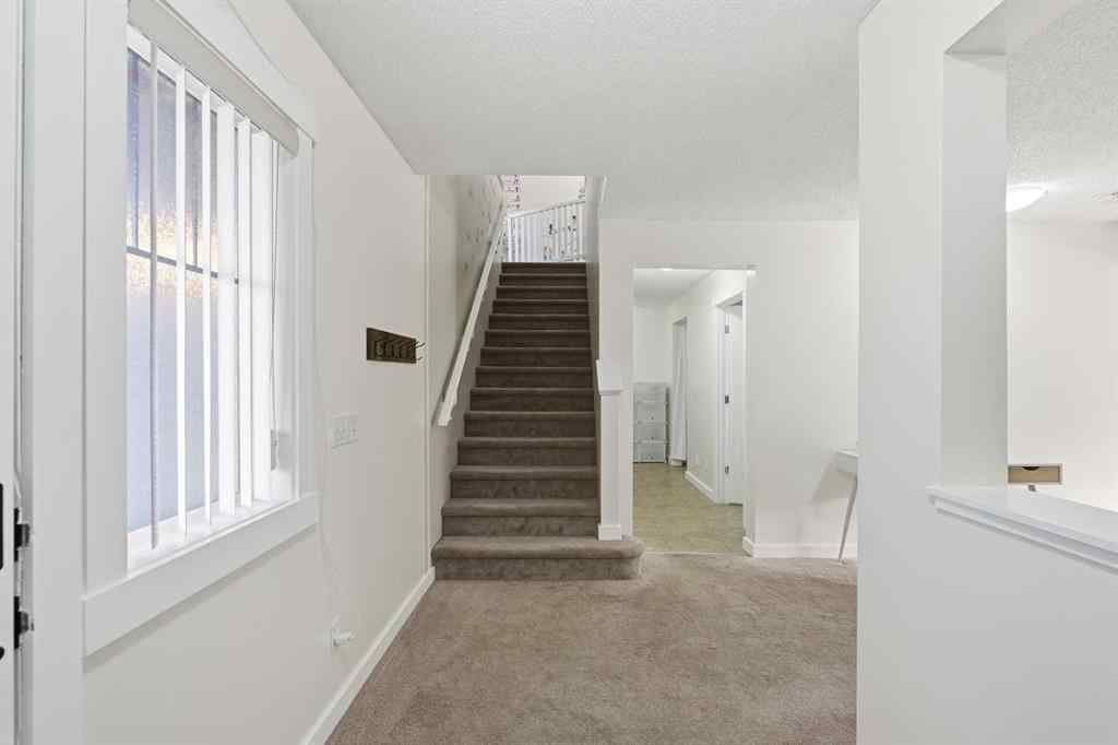 MLS® A2267001 - 217 coopers Grove SW in Coopers Crossing Airdrie, Residential