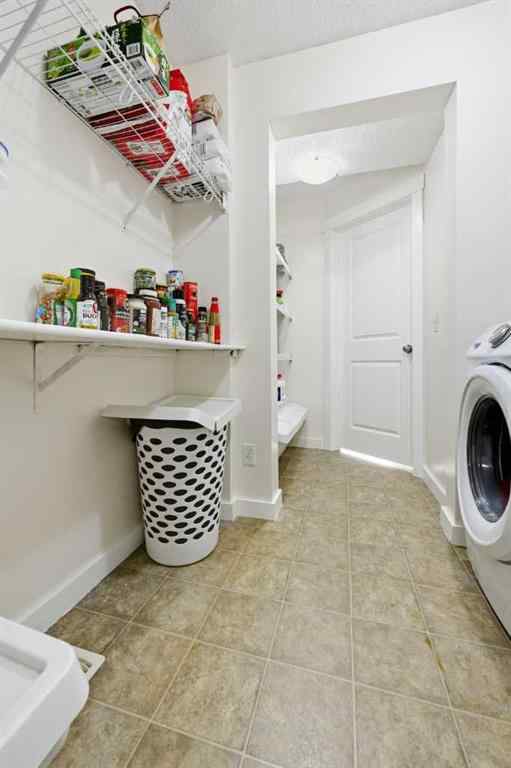 MLS® A2267001 - 217 coopers Grove SW in Coopers Crossing Airdrie, Residential