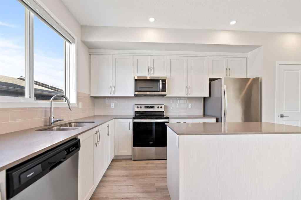 MLS® A2267008 - 281 Creekside Boulevard SW in Pine Creek Calgary, Residential
