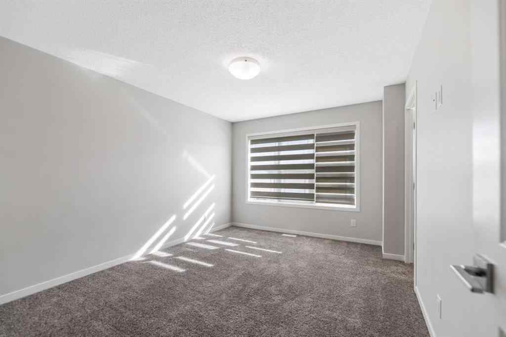 MLS® A2267008 - 281 Creekside Boulevard SW in Pine Creek Calgary, Residential