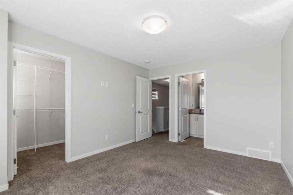 MLS® A2267008 - 281 Creekside Boulevard SW in Pine Creek Calgary, Residential