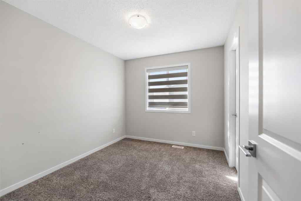 MLS® A2267008 - 281 Creekside Boulevard SW in Pine Creek Calgary, Residential
