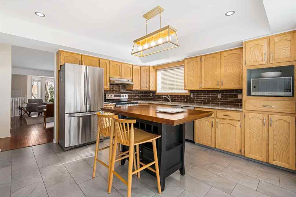 MLS® A2267009 - 95 Macewan Meadow Way NW in MacEwan Glen Calgary, Residential